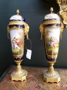 A pair Sévres vases in porcelain and gilded brons.