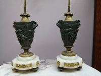 A pair bronze gilded and patinated lamps.