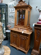 A wallnut carved cabinet.