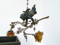 A bronze lamp with a putto.