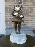sculpture by G.Omert child with doll