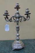 A solid silver candelabra signed by Salinas.