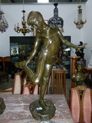 A nice bronze sculpture of a boy bitten by a crab.