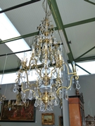 A very large bronze and crystal lamp.