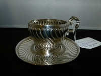 A silver cup by Chevroy.