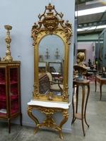 A German gilded console and mirror.